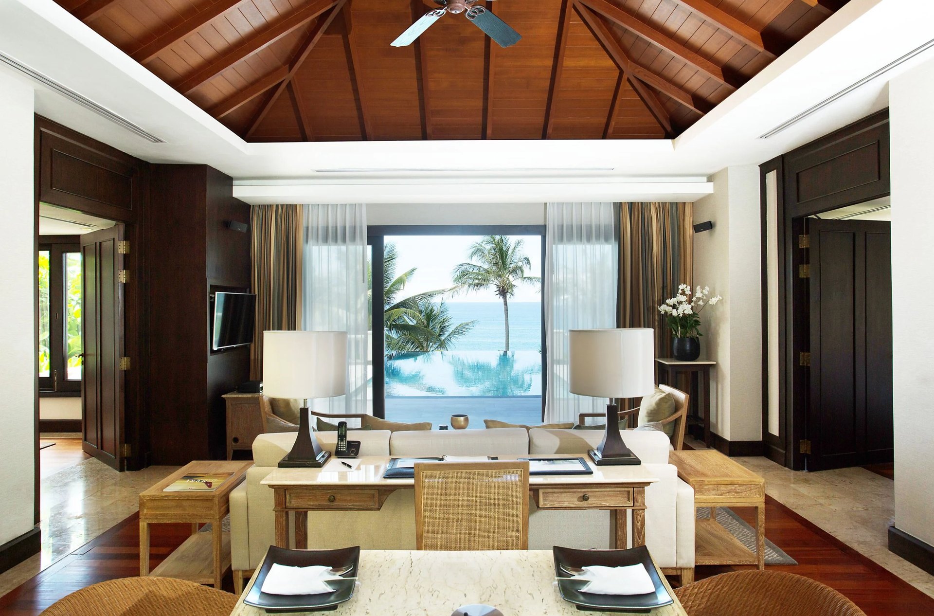 The living room of a pool villa at Trisara, opening onto the sea