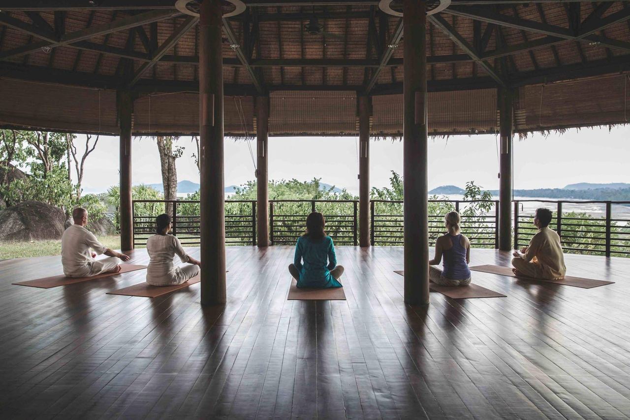 A yoga class in Kamalaya’s open-sided pavilion above the sea