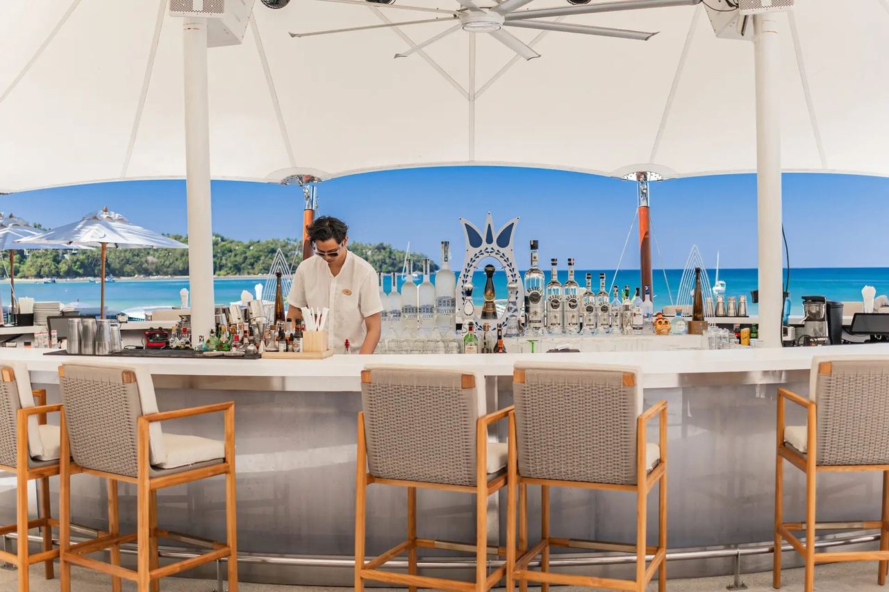 The beach bar at Catch Beach Club, open to Bang Tao Bay