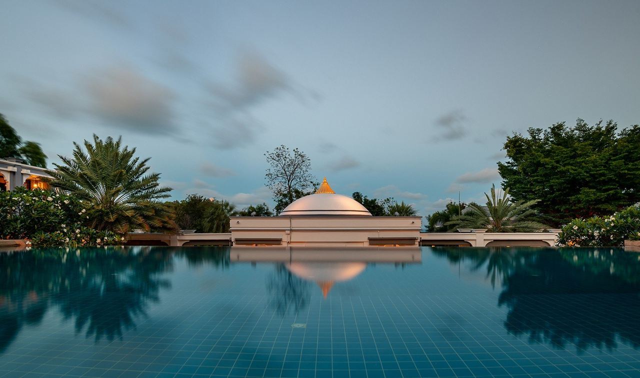 The pool and the domed pavilion at Absolute Sanctuary at dusk