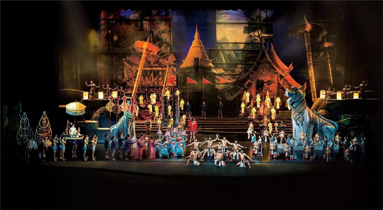 The full cast on stage at Siam Niramit Phuket in front of a temple set